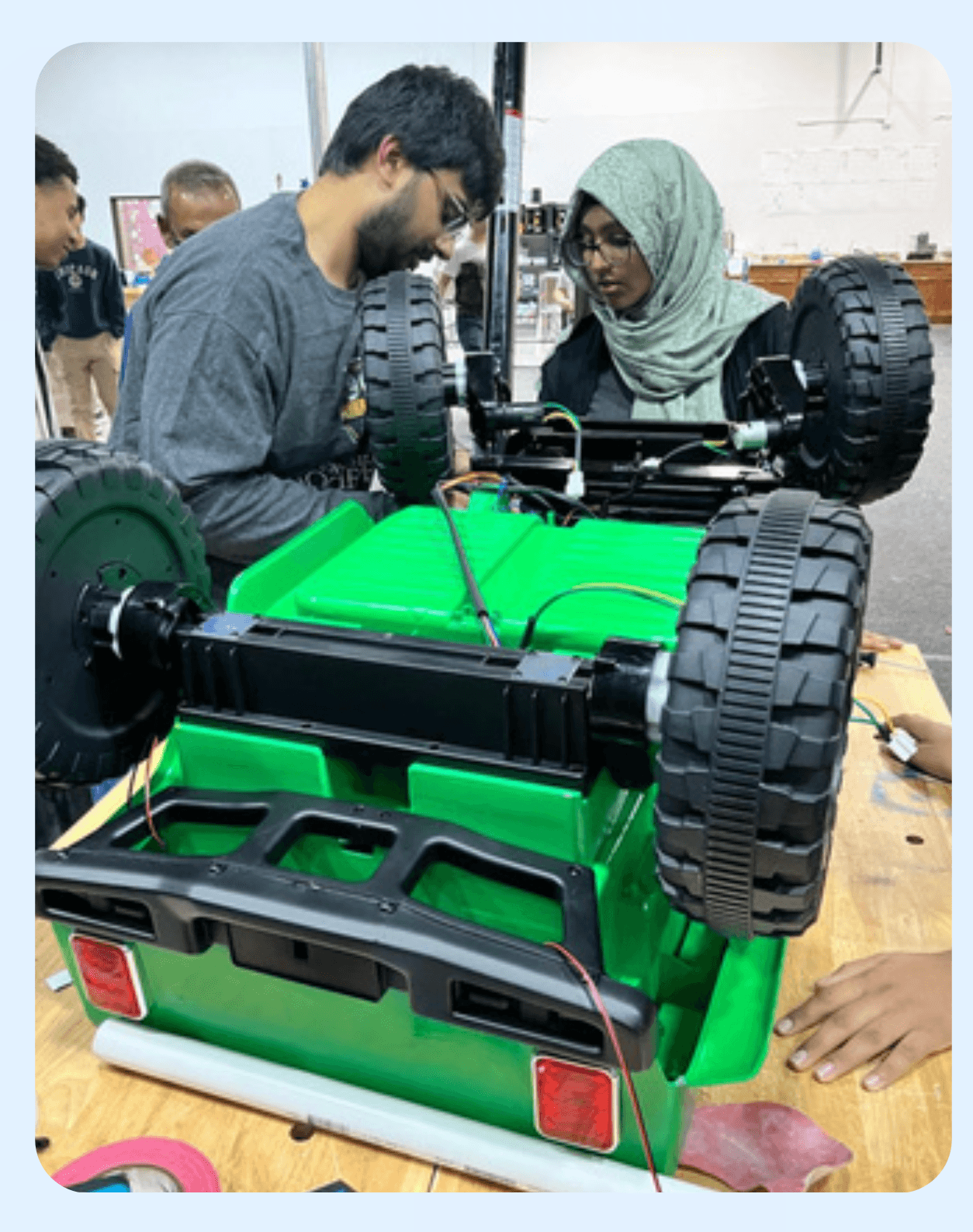ITKAN students building a custom ride-on car for Go-Baby-Go