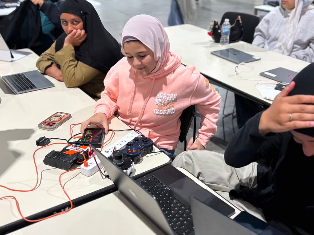 Hands-on with hardware: students wire up and test a control system.